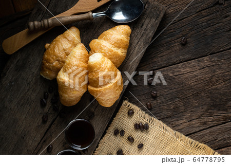 Coffee and croissants on the wooden background, Coffee and croissants on the wooden background, 64778795
