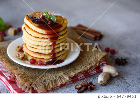 Delicious fresh beautiful pancakes with citrus Delicious fresh beautiful pancakes with citrus 64779451
