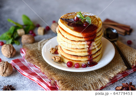Delicious fresh beautiful pancakes with citrus Delicious fresh beautiful pancakes with citrus 64779453