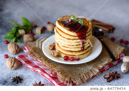 Delicious fresh beautiful pancakes with citrus Delicious fresh beautiful pancakes with citrus 64779454