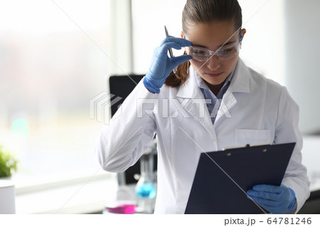 Scientist noting information of researching Scientist noting information of researching 64781246