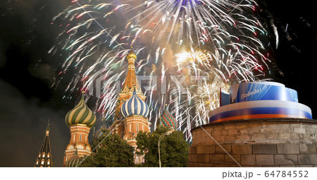 Temple of Basil the Blessed and fireworks in honor of Victory Day celebration (WWII), Moscow, Russia. 64784552