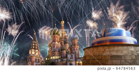 Temple of Basil the Blessed and fireworks in honor of Victory Day celebration (WWII), Moscow, Russia. 64784563