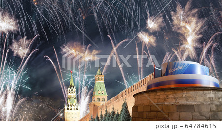 Moscow Kremlin and fireworks in honor of Victory Day celebration (WWII),  Red Square, Moscow, Russia. 64784615