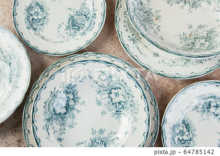 Antique porcelain dishes on concrete Antique porcelain dishes on concrete 64785142