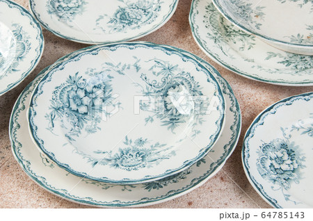 Antique porcelain plates on concrete Antique porcelain plates on concrete 64785143