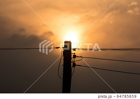 Sunset and Eletricity line and electricity post Sunset and Eletricity line and electricity post 64785659