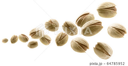 Salted pistachios levitate on a white background Salted pistachios levitate on a white background 64785952