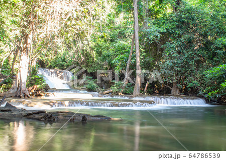 Waterfall flowing from the mountains at Huay Mae khamin waterfall National Park ,Kanchana buri. Waterfall flowing from the mountains at Huay Mae khamin waterfall National Park ,Kanchana buri. 64786539