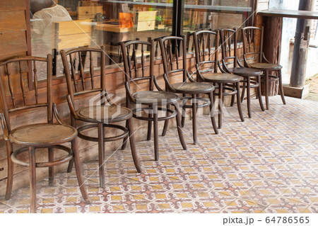 Old wooden chairs in the aisles Old wooden chairs in the aisles 64786565