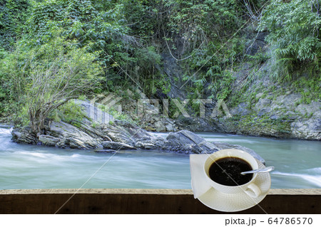 Isolated Hot coffee Put a glass of white with a casual break from work  background waterfall 64786570