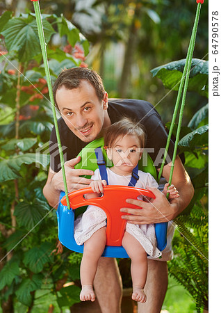 Young dad play with daughter Young dad play with daughter 64790578