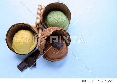 Vegetarian sorbet ice-cream scoop in coco shell Vegetarian sorbet ice-cream scoop in coco shell 64793071