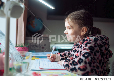 little girl at distance home schooling, study lessons on quarantine 64794474