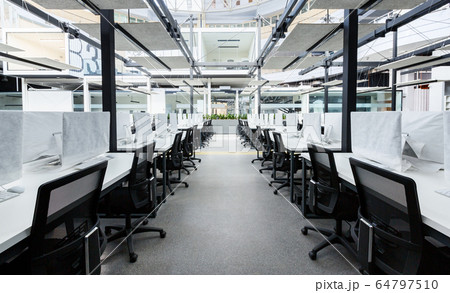 Co-working space with modern computers hiding by covers Co-working space with modern computers hiding by covers 64797510