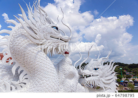 Dragon statue with blue sky and clouds sky at Huay Pla Kang Temple, Chiangrai, Thailand. Dragon statue with blue sky and clouds sky at Huay Pla Kang Temple, Chiangrai, Thailand. 64798795