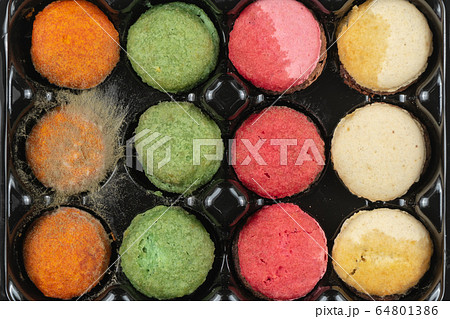 Mold on cookies in tray. Moldy, expired macarons cookies 64801386