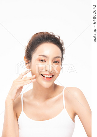 Beautiful Asian woman touching soft cheek smile with clean and fresh skin Happiness 64802642