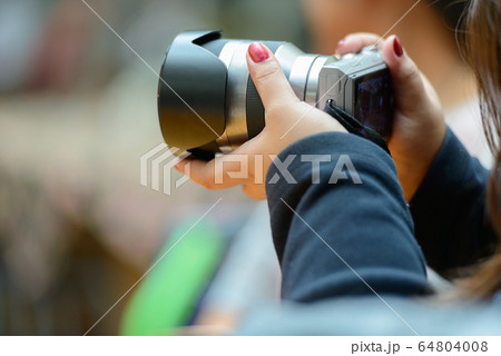 Hand of overweight woman taking picture with camera at cafe Hand of overweight woman taking picture with camera at cafe 64804008