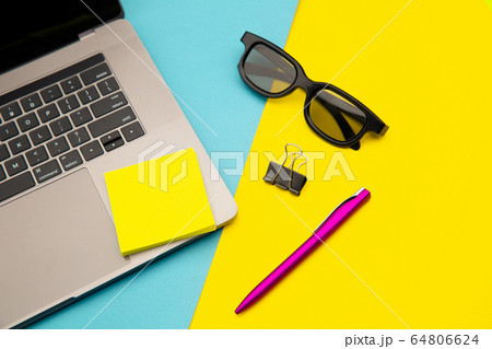 Home workplace with yellow sticky note, place for text. Pandemic Covid-19 Coronavirus quarantine concept 64806624