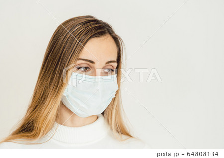 Woman contemplating what lies ahead during Coronavirus crisis 64808134