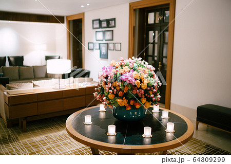 Large floral arrangement in a vase at a wedding, in the lobby of the hotel Large floral arrangement in a vase at a wedding, in the lobby of the hotel 64809299