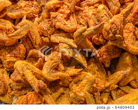 Big pile of deep-fried chicken wings for food background concept 64809403