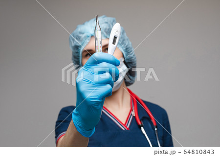 Portrait of female doctor in medical clothes with Portrait of female doctor in medical clothes with 64810843