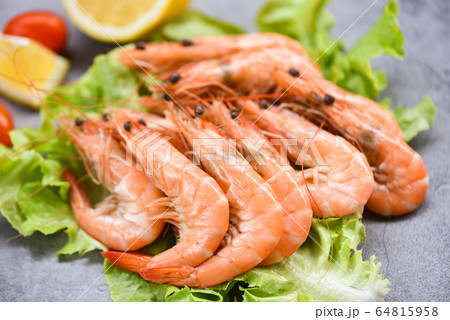 Cooking seafood shrimps prawns served on a table 64815958