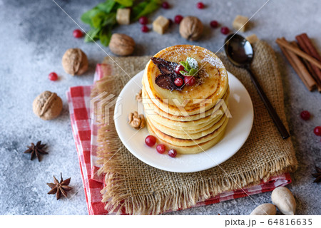 Delicious fresh beautiful pancakes with citrus Delicious fresh beautiful pancakes with citrus 64816635
