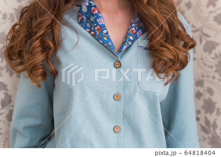 Warm kit homewear. Soft cotton shirt. Comfortable clothes for healthy sleep. Pajamas concept. Close-up. Warm kit homewear. Soft cotton shirt. Comfortable clothes for healthy sleep. Pajamas concept. Close-up. 64818404