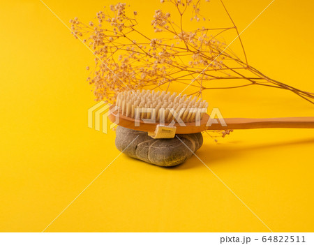 Zero waste dry massage wooden brush on yellow Zero waste dry massage wooden brush on yellow 64822511
