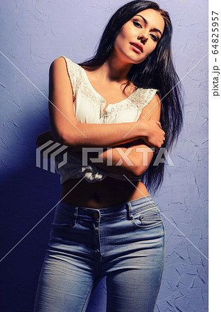 Sexy tanned brunette girl in a white vest and Sexy tanned brunette girl in a white vest and 64825957