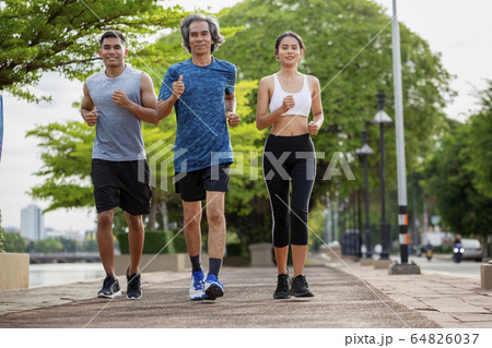 Family exercising and jogging together  64826037