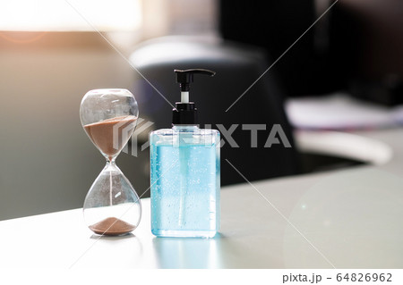 hand alcohol gel sanitizer dispenser and Hourglass 64826962