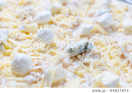 Close up image of cheese pizza ready for baking Close up image of cheese pizza ready for baking 64827853