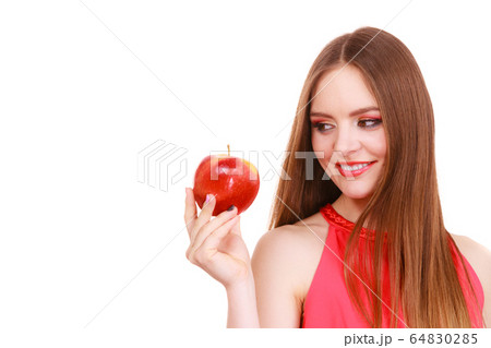 Woman charming girl colorful makeup holds apple 64830285