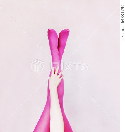 Female legs wearing pink tights Female legs wearing pink tights 64831790