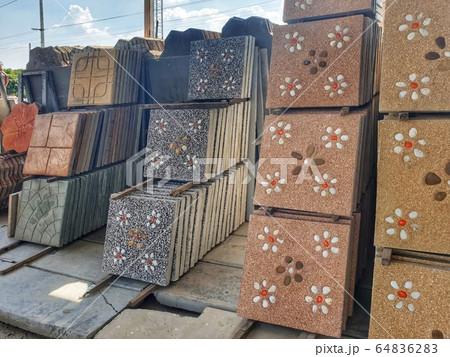 Shop sells exterior floor tiles are arranged in groups according to patterns for customers to choose conveniently. Shop sells exterior floor tiles are arranged in groups according to patterns for customers to choose conveniently. 64836283