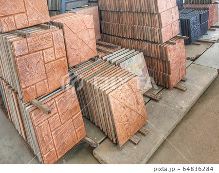 Shop sells exterior floor tiles are arranged in groups according to patterns for customers to choose conveniently. 64836284