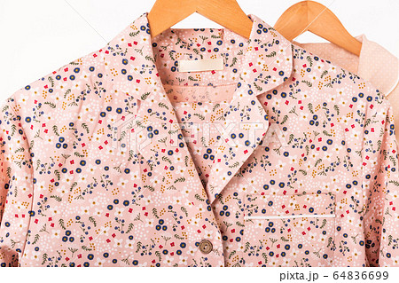 Clothing retails concept. Ladies pajamas on hangers in clothes store. Pajama in shop. Advertise, sale, fashion and shopping concept. Clothing retails concept. Ladies pajamas on hangers in clothes store. Pajama in shop. Advertise, sale, fashion and shopping concept. 64836699