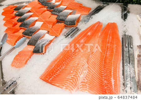 Blocks of fresh raw salmon fillet display for sale 64837484