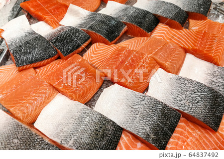Blocks of fresh raw salmon fillet display for sale 64837492