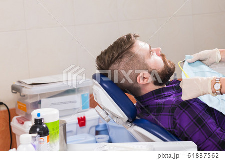 Doctor and patient in the dental clinic. dentistry and dental health concept. Doctor and patient in the dental clinic. dentistry and dental health concept. 64837562