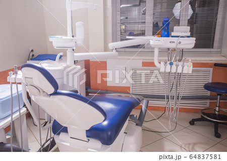 Dentist tools and professional dentistry chair waiting to be used by orthodontist 64837581