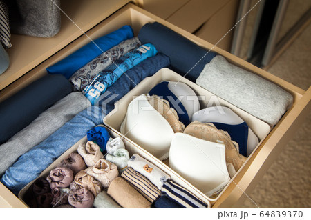 Top view of neatly folded things in grey blue color 64839370