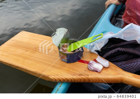 Canoing trip tuna can eating Canoing trip tuna can eating 64839401