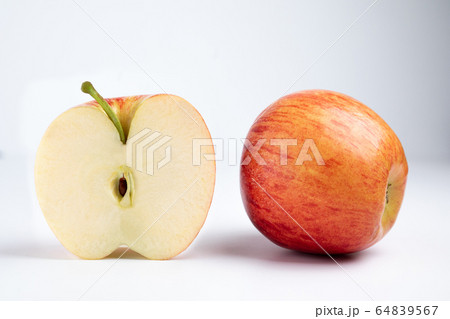 Isolated apples. Whole red apple and a half isolated on white background with clipping path Isolated apples. Whole red apple and a half isolated on white background with clipping path 64839567