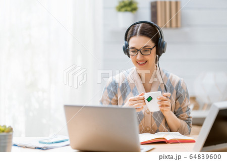 Woman working on a laptop. Woman working on a laptop. 64839600