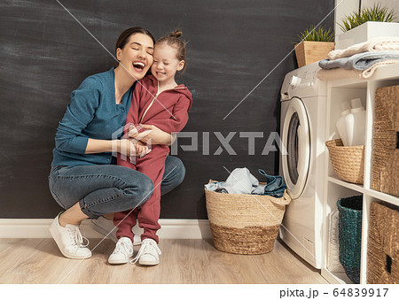 family doing laundry family doing laundry 64839917